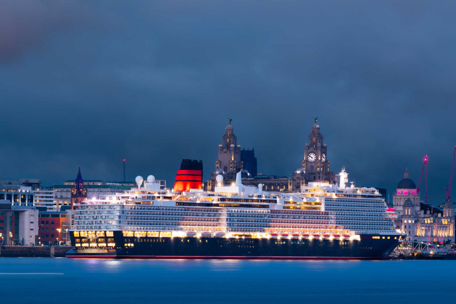 queen anne docked in liverpool with the stunning skyline