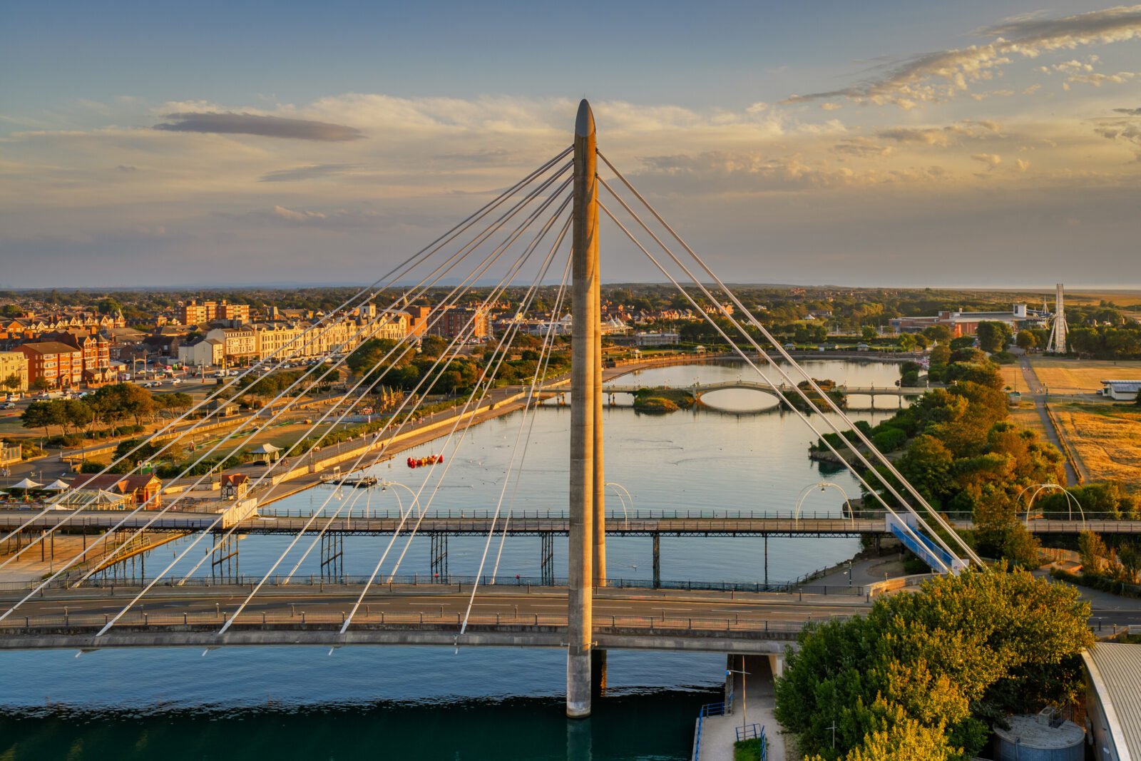 Aerial view of Southport Marine Way Bridge and Marine Lake at golden hour