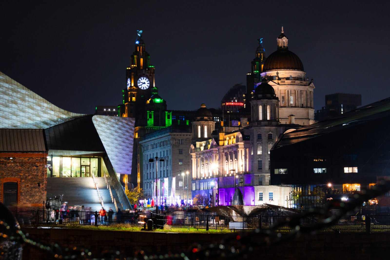 Liverpool waterfront at night with Royal Liver Building, Port of Liverpool Building and Museum of Liverpool illuminated
